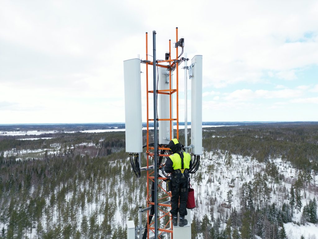 Field Technician climbing tower in Grande Prarie - upgrading wifi towers